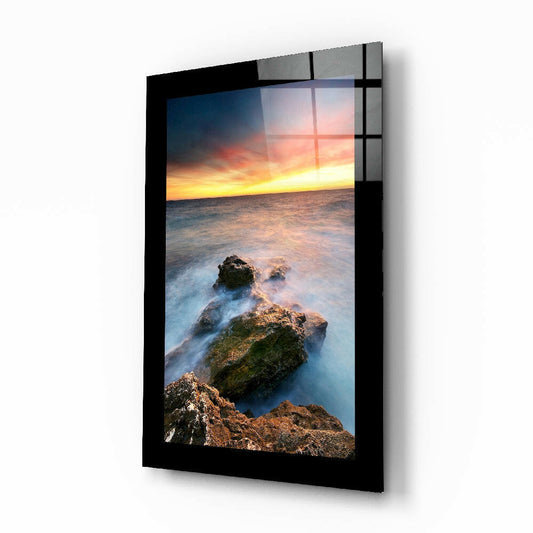Sunset on the Beach glass wall art displayed above a bed in a bedroom