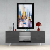 Sailboats glass wall art styled above a console in a reading nook
