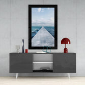 Far Horizon glass wall art styled above a console in a coastal cottage