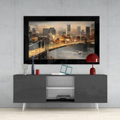 Brooklyn Bridge glass wall art styled above a console in a reading nook