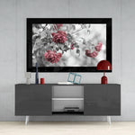 Rosewood glass wall art styled above a console in a reading nook