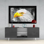 Eagle glass wall art styled above a console in a library