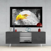 Eagle glass wall art styled above a console in a library