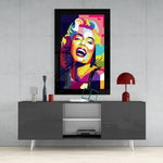 Marilyn Monroe glass wall art styled above a sideboard in a media room