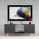 Cute Bird glass wall art styled above a sideboard in a creative studio
