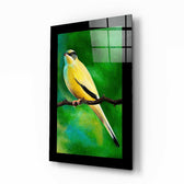 Bird on Branch glass wall art displayed above a bed in a bedroom