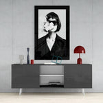 Smoke and Woman glass wall art styled above a console in a music room