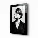 Smoke and Woman glass wall art displayed above a vanity in a dressing room