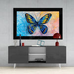 Colorful Butterfly glass wall art styled above a console in a sunroom