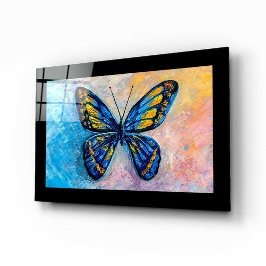Colorful Butterfly glass wall art displayed above a bed in a bedroom