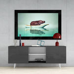 Hippo glass wall art styled above a sideboard in a reading nook
