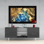 Gold Blue glass wall art styled above a console in a bedroom