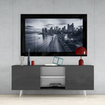 New York glass wall art styled above a console in a media room
