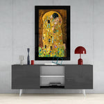 Gustav Klimt 'The Kiss' glass wall art styled above a sideboard in a dining room
