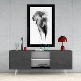 Elephant glass wall art styled above a console in a reading nook