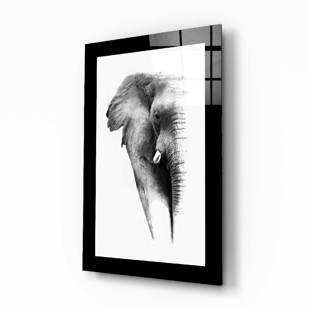 Elephant glass wall art displayed above a sideboard in a study