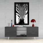 Zebra glass wall art styled above a console in a man cave