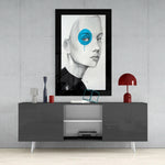 Blue Vision glass wall art styled above a console in a reading nook