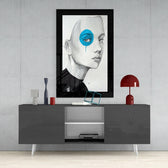 Blue Vision glass wall art styled above a console in a reading nook