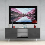 Sakura Trees glass wall art styled above a console in a reading nook