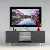 Sakura Trees glass wall art styled above a console in a reading nook