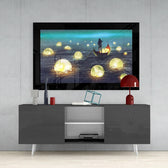 Moon Collector glass wall art styled above a console in a reading nook