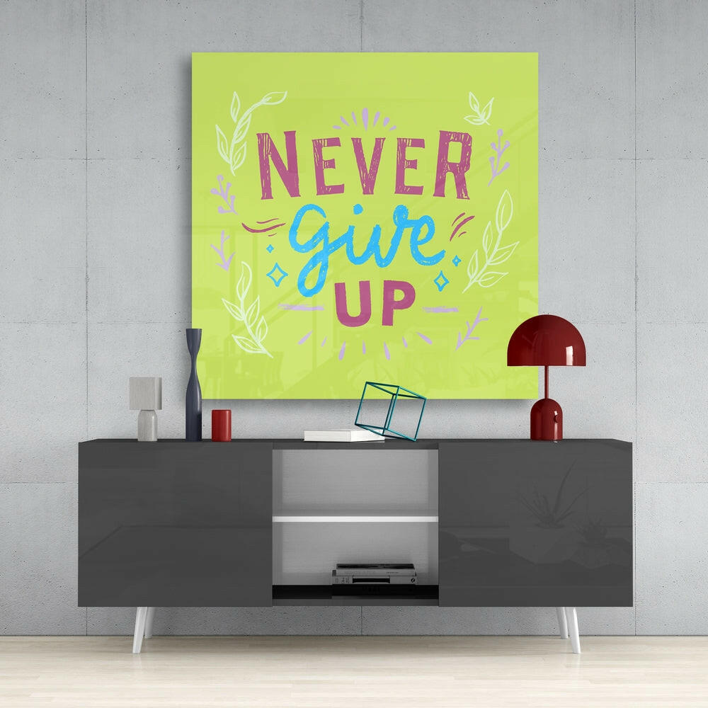 “Never Give Up” Glass Wall Art.