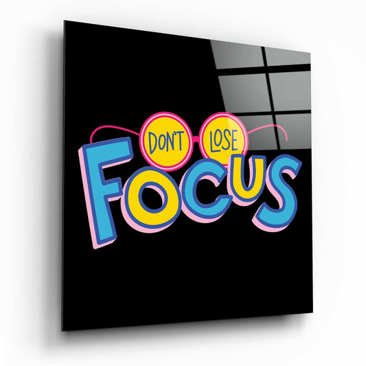 Don't Lose Focus glass wall art displayed above a console in a designer interior
