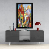 Houses glass wall art styled above a sideboard in a foyer
