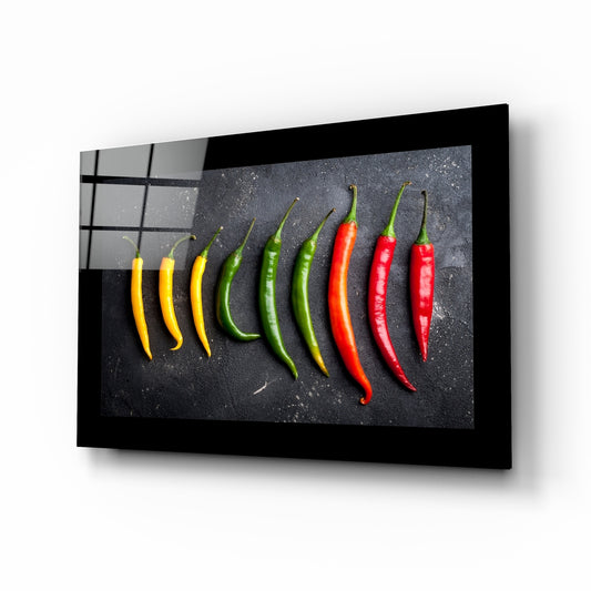 Peppers glass wall art displayed above a sideboard in a kitchen