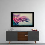 Flower glass wall art styled above a console in a reading nook