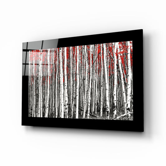 Red Forest glass wall art displayed above a sideboard in a study