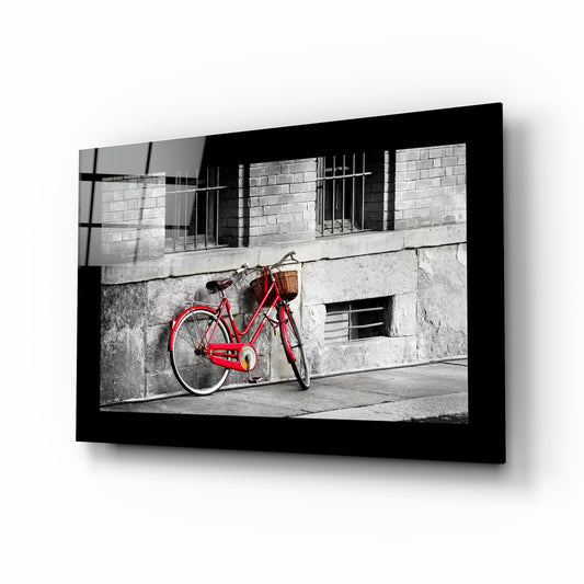 Red Bike glass wall art displayed above a console in an entryway