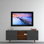 Sunset at the Pier glass wall art styled above a console in a meditation room