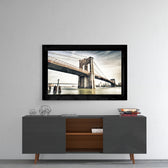 Brooklyn Bridge glass wall art styled above a console in a media room
