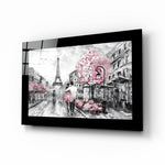 Pink and Paris glass wall art displayed above a bed in a bedroom