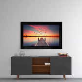 Sunset glass wall art styled above a console in a meditation room