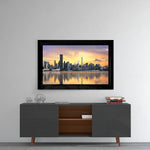 The City glass wall art styled above a console in a reading nook