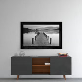 Pier glass wall art styled above a console in a meditation room