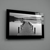 Editorial-photo panel bringing monochrome calm to a coastal cottage