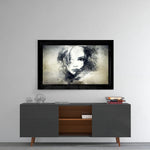 Woman glass wall art styled above a console in a creative studio