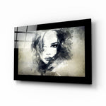 Woman glass wall art displayed above a bed in a bedroom