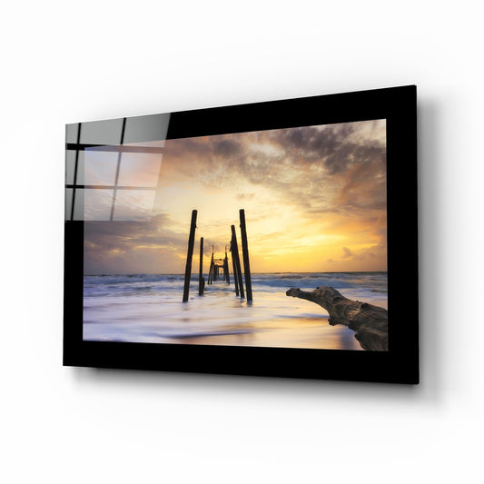 Sunset glass wall art displayed above a sideboard in a coastal cottage