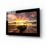 Sunset glass wall art displayed above a sideboard in a coastal cottage