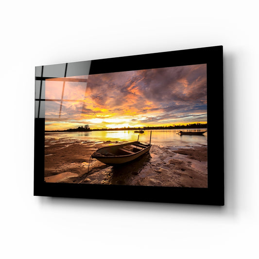 Sunset glass wall art displayed above a sideboard in a coastal cottage
