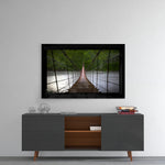 Forest Bridge glass wall art styled above a console in a reading nook