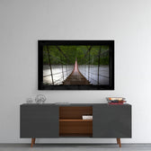Forest Bridge glass wall art styled above a console in a reading nook