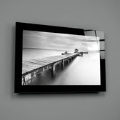 Editorial-photo panel bringing monochrome calm to a coastal cottage