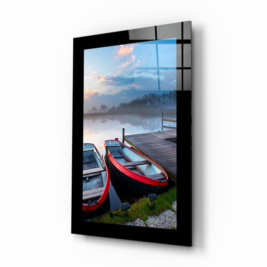 Boats glass wall art displayed above a bed in a bedroom