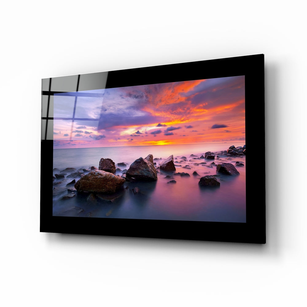 Sunset glass wall art displayed above a sideboard in a study